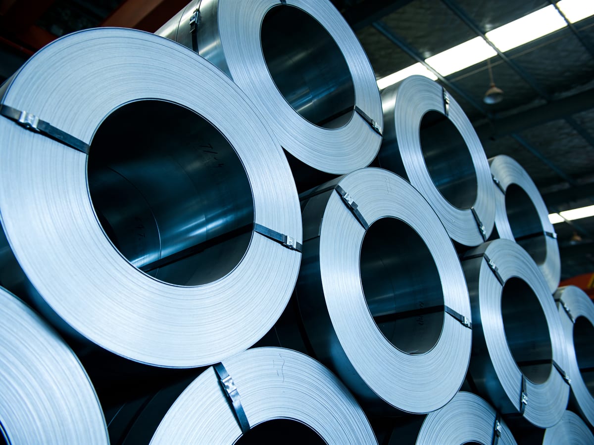 Rolled stainless steel coils in a warehouse