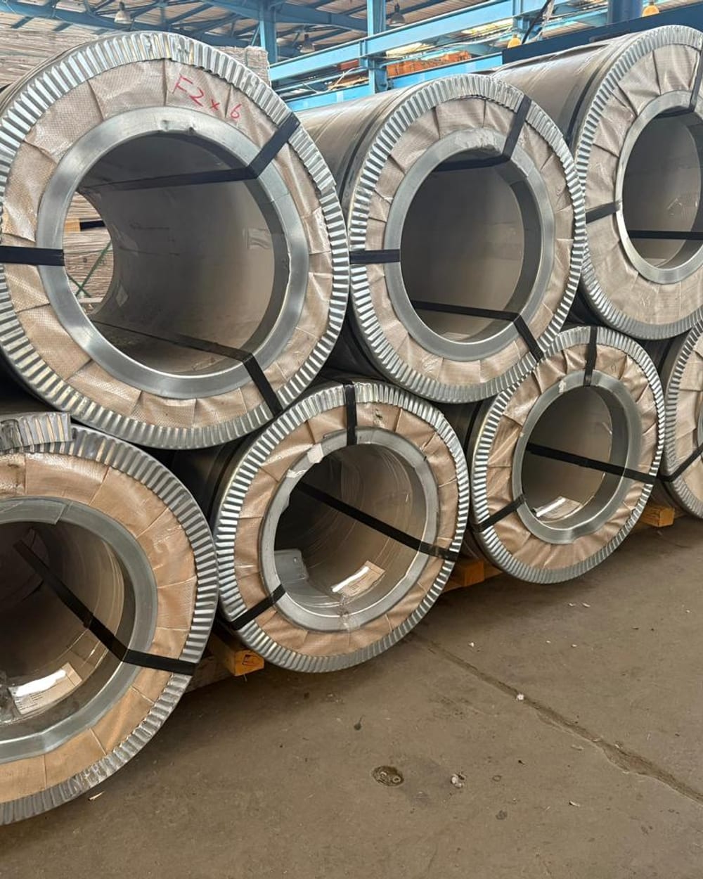 Stacked stainless steel coils in stock at ETA's warehouse